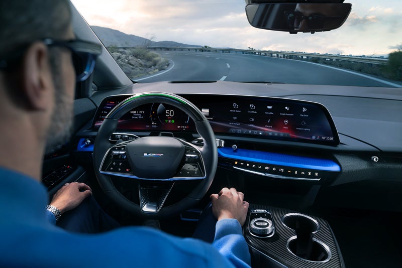 Front View of the 2026 OPTIQ-V Driving Through the Dusk Utilizing its Headlights | Dan Vaden Chevrolet Savannah in Savannah GA