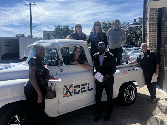 Students learning car buying tips at Vaden Automotive workshop